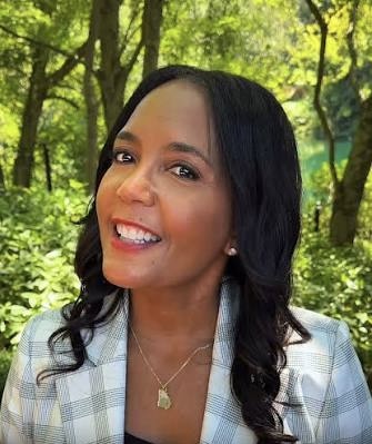 Keisha Lance Bottoms smiling in a navy suit